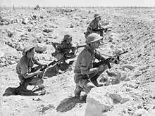 Image 13Australian infantry at Tobruk during World War II. Beginning on 10 April 1941, the Siege of Tobruk lasted for 240 days. (from History of Libya)