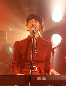 Lisa Jen Brown performing with 9Bach at Gwyl Hanner Cant, a celebration of 50 years of Cymdeithas yr Iaith Gymraeg