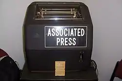 Vintage teletype machine labeled "Associated Press"